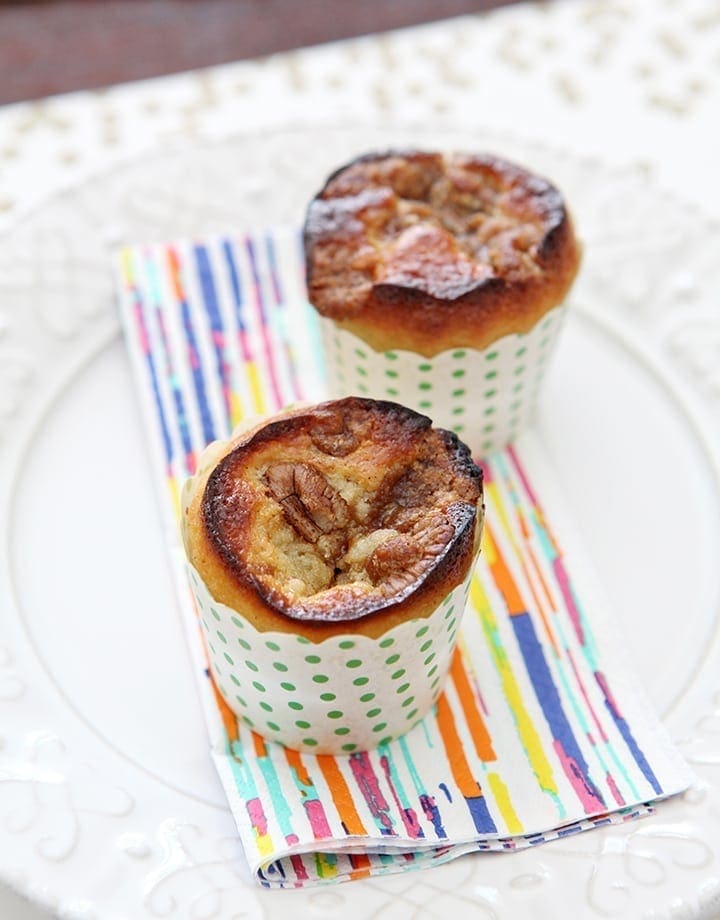 Fluffy, delicious Vanilla Bean Coffee Cake Muffins, filled and topped with a pecan streusel. These muffins are the perfect sweet addition to any weekend breakfast or brunch!