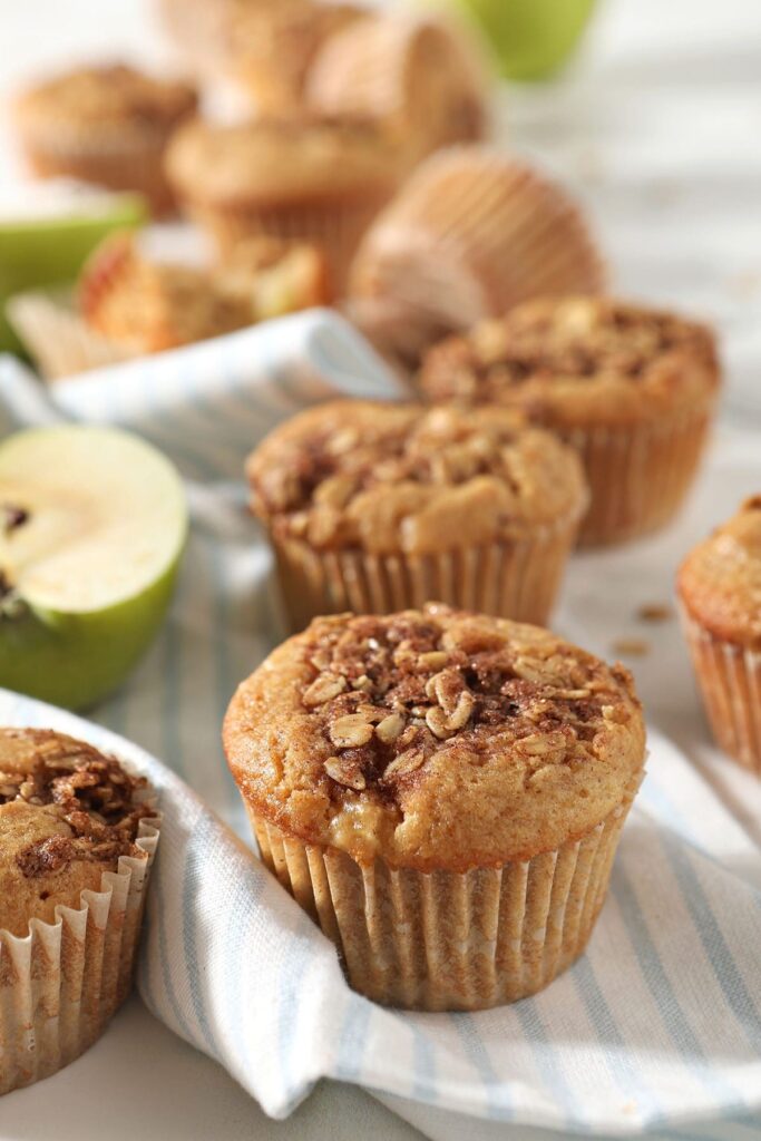 Apple Cinnamon Muffins on a blue striped towel