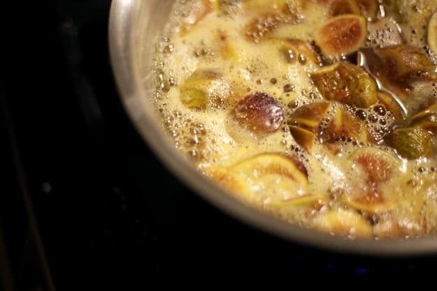 Close up view of figs simmering in a pot 