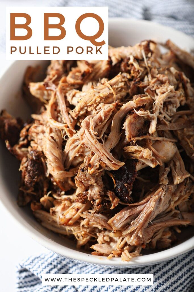 Pulled pork in a white bowl with the text bbq pulled pork