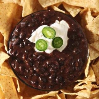 Close up of Black Bean Dip, garnished and ready for dipping