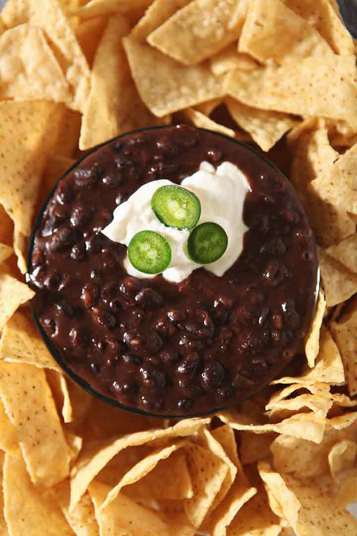 Close up of Black Bean Dip, garnished and ready for dipping