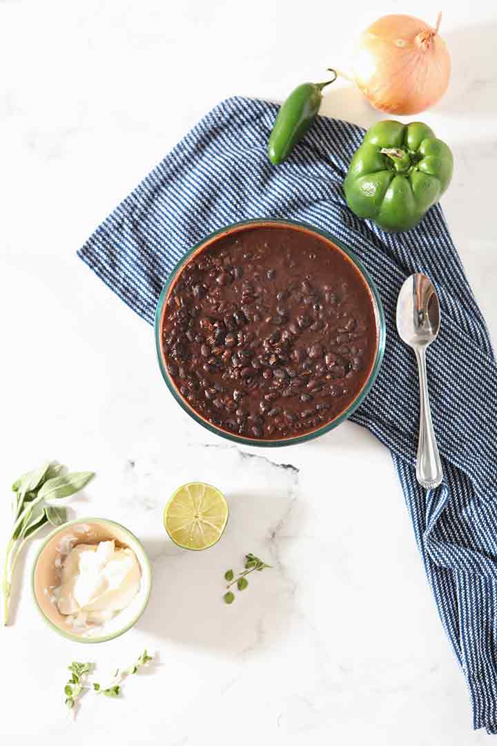 The cooked Black Bean Dip, shown with other ingredients and garnishes, before serving