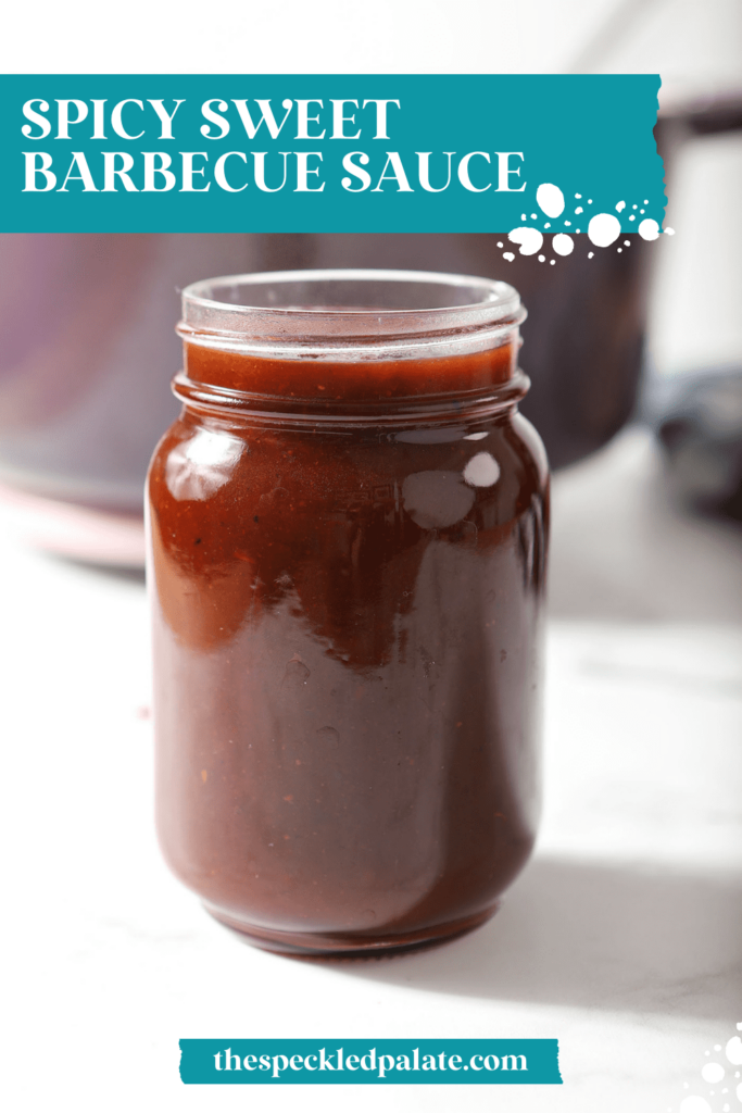 A jar of homemade BBQ sauce in front of a purple Dutch oven with the text Spicy Sweet Barbecue Sauce