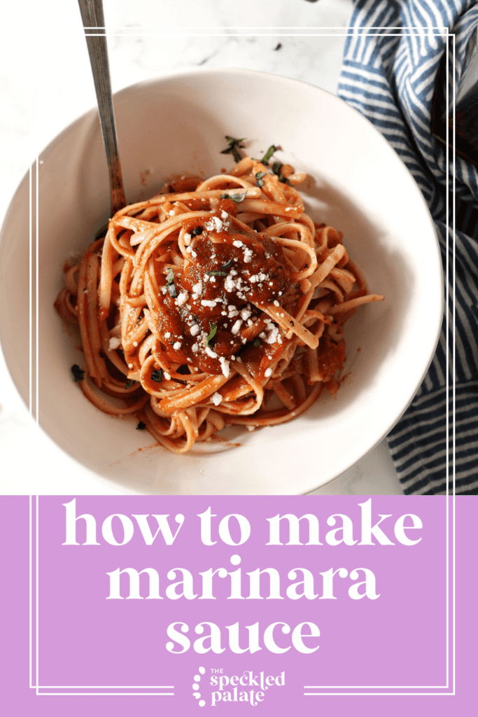 A bowls of pasta covered in a simple marinara sauce on marble next to two glasses of red wine and a container of grated parmesan cheese with the text how to make marinara sauce