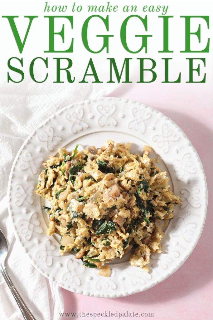 A white plate holds a large serving of Scrambled Eggs with Spinach, mushrooms and onions with the text 'how to make an easy veggie scramble'