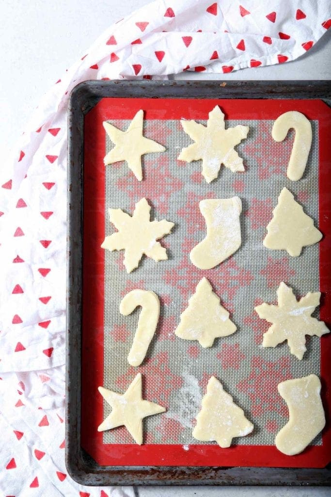 Cut out All-Butter Tea Cake Cookie Dough sits on a baking sheet before going into the oven