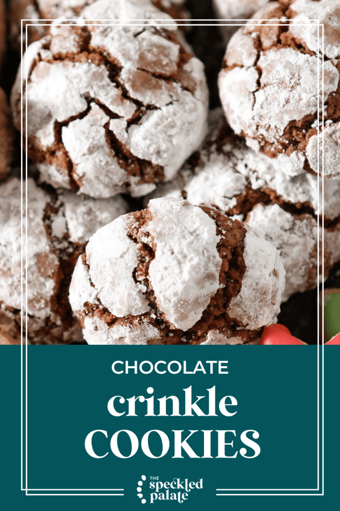 Close up of chocolate cookies coated in powdered sugar with the text chocolate crinkle cookies