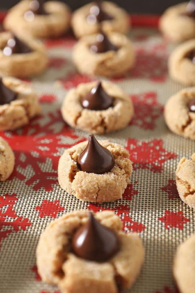 Baked Peanut Blossoms on a festive sheet pan after baking