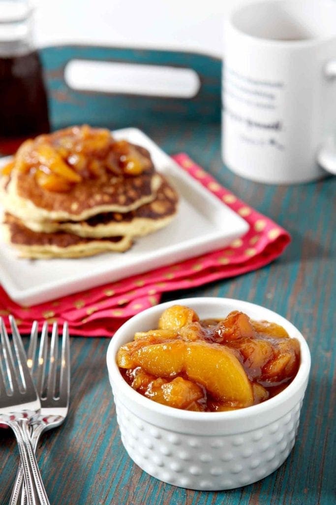 Peach compote in a ramekin, before serving over breakfast