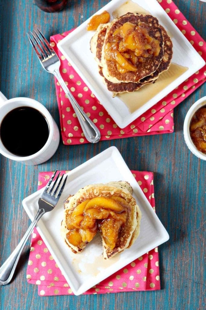 Overhead of stacks of pancakes served with compote