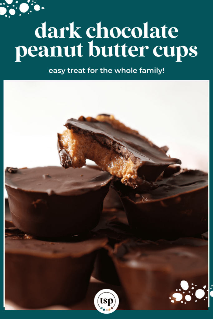 A bitten-into peanut butter cup held in a hand above a pink plate with the text Dark Chocolate Peanut Butter Cups