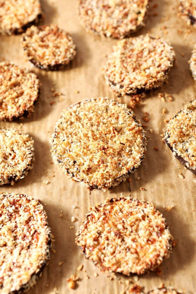 Crispy eggplant slices on a sheet pan after baking