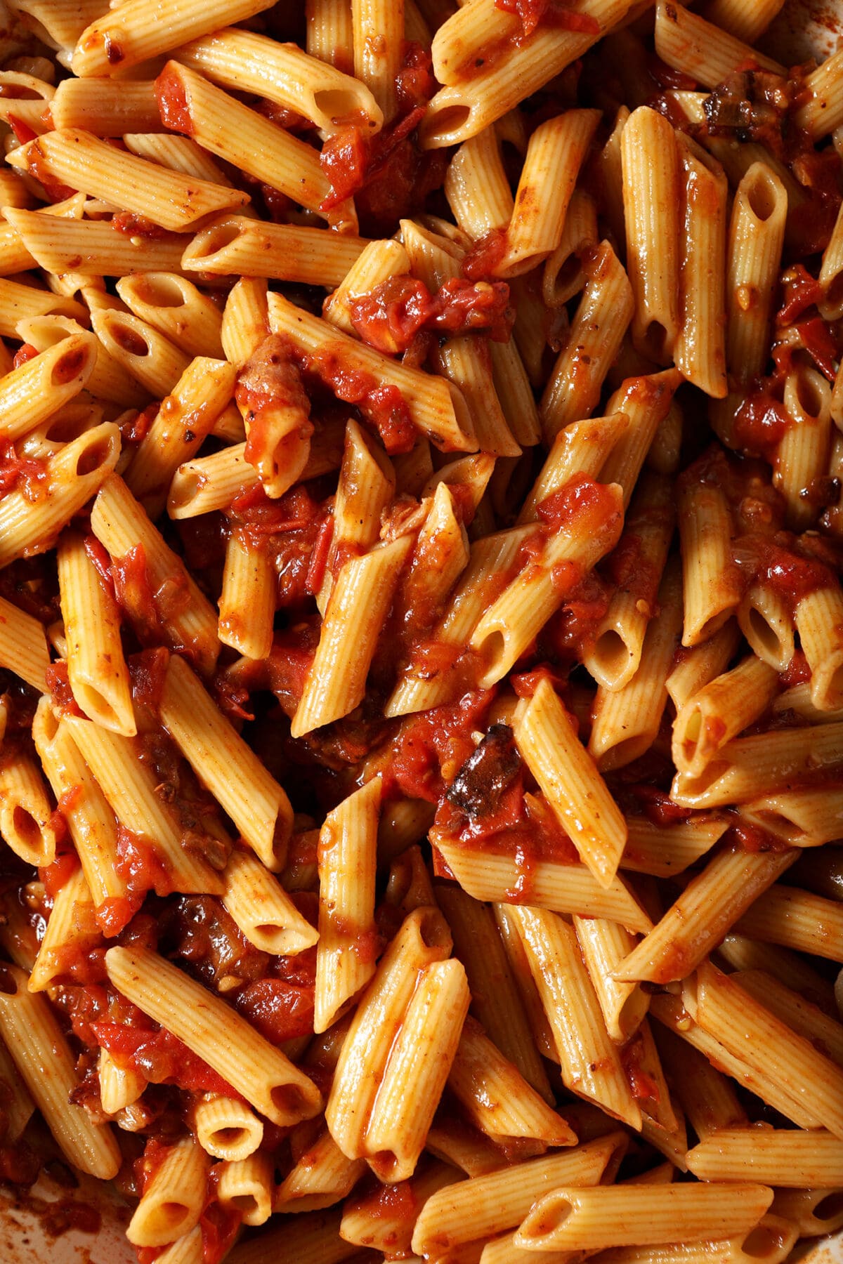 Overhead of penne pasta in a red sauce
