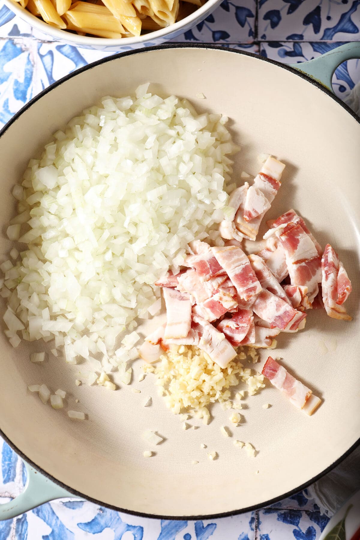 Onion, garlic and bacon in a large skillet before cooking