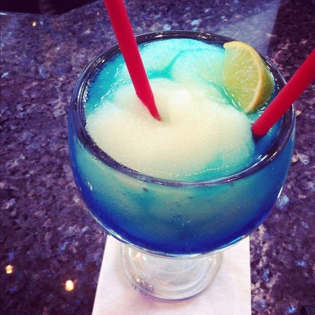 A close up of a frozen Blue Margarita on a granite counter