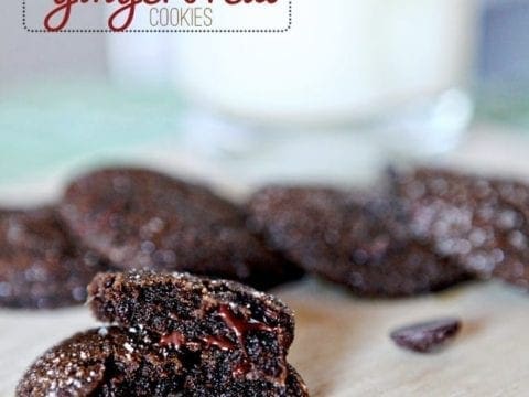 A close up of a halved Chewy Chocolate Gingerbread Cookies with other cookies behind it