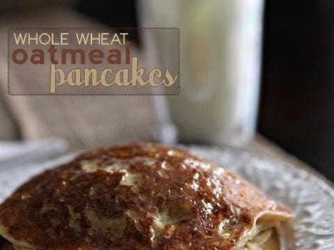 A stack of Whole Wheat Oatmeal Pancakes with syrup on a white plate