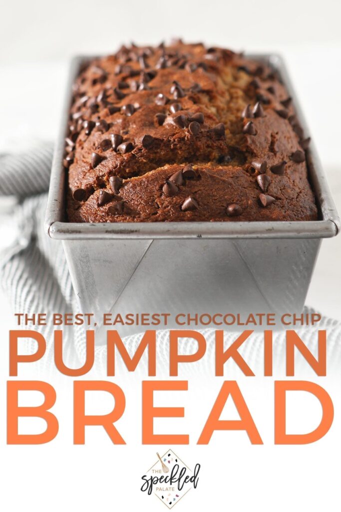 Close up of a loaf of pumpkin bread in a metal pan topped with chocolate chips with the text 'the best, easiest chocolate chip pumpkin bread'