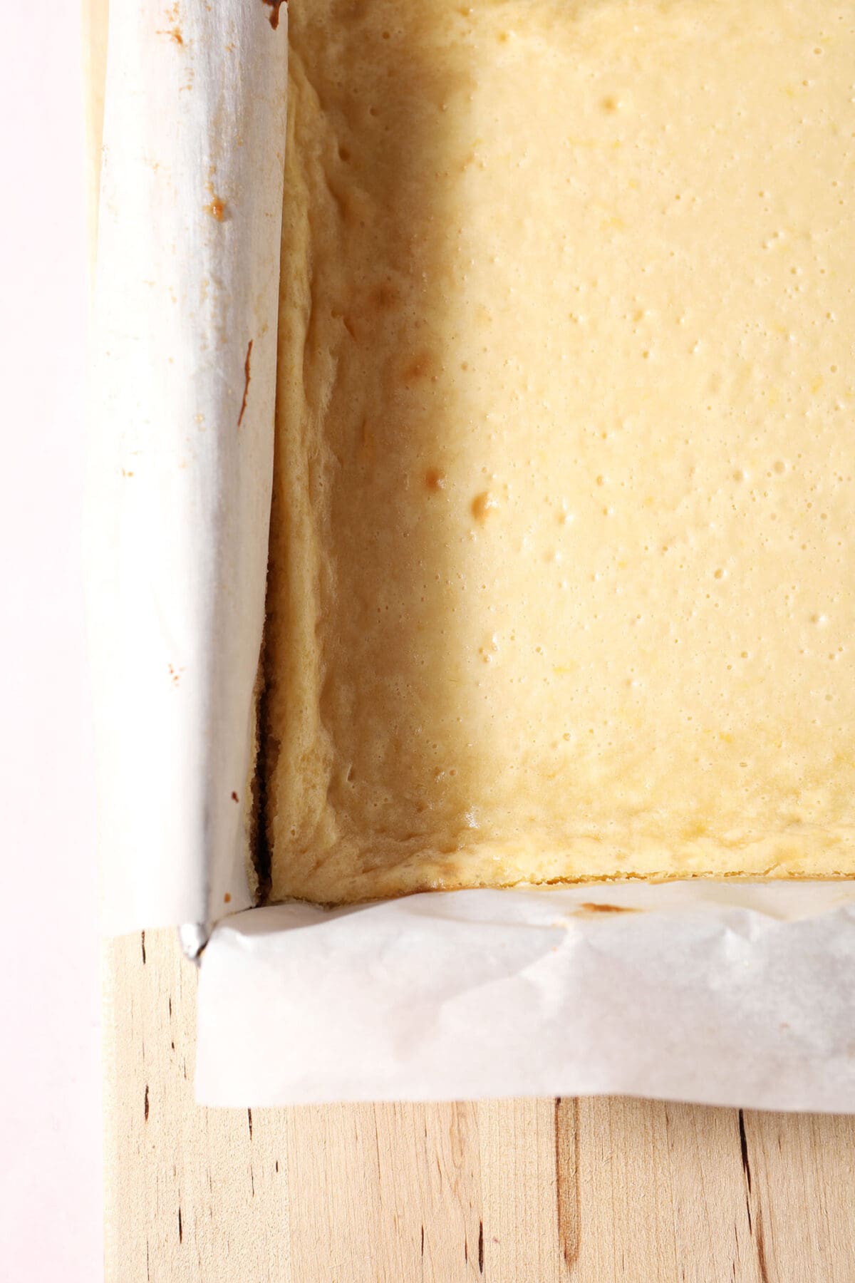 baked cheesecake bars in a square pan