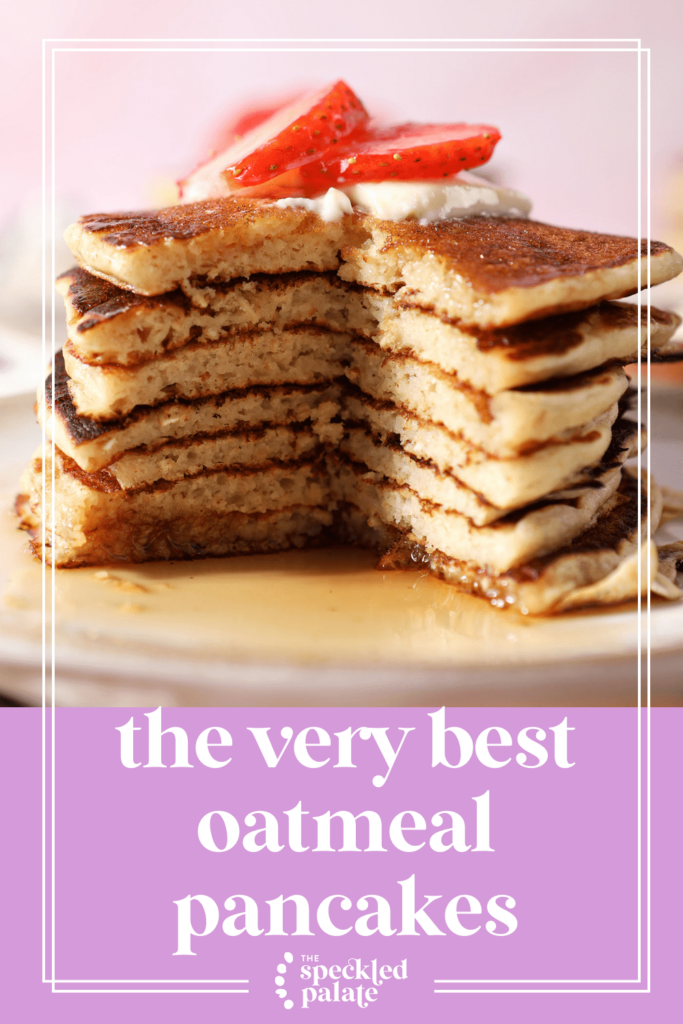 Close up of a cut-into stack of pancakes topped with strawberries with the text the very best oatmeal pancakes