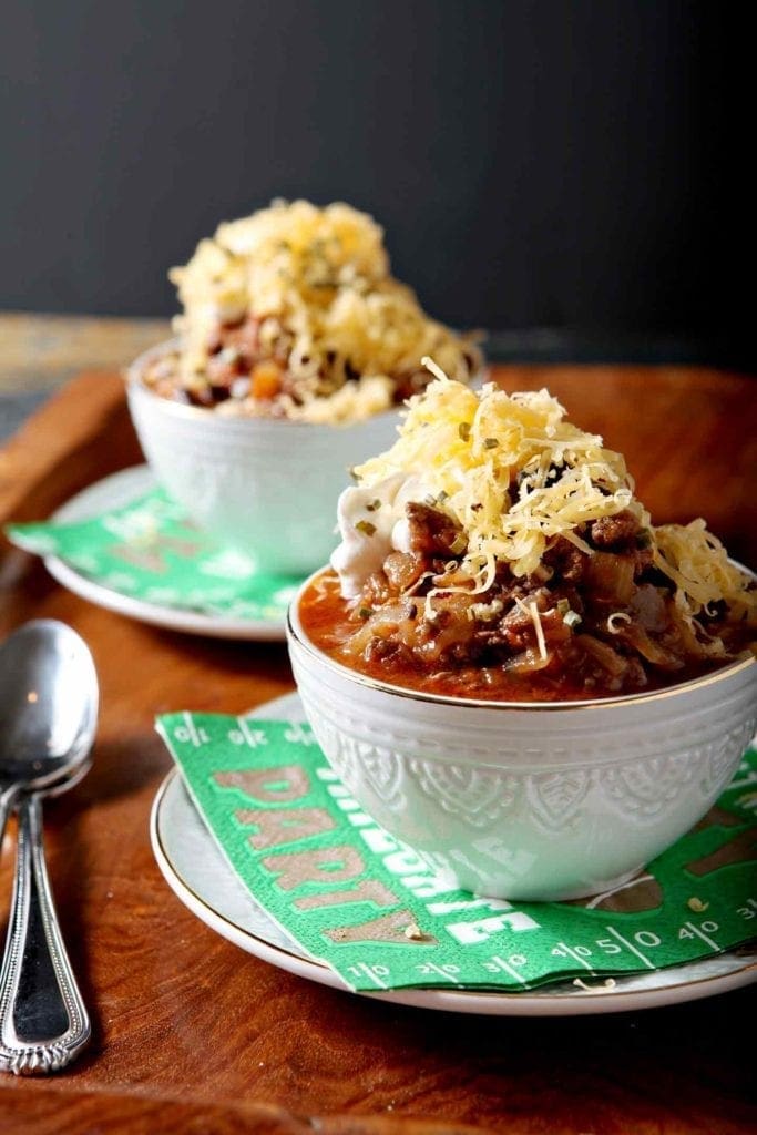 Two bowls of Shiner Bock Chili on a wooden platter