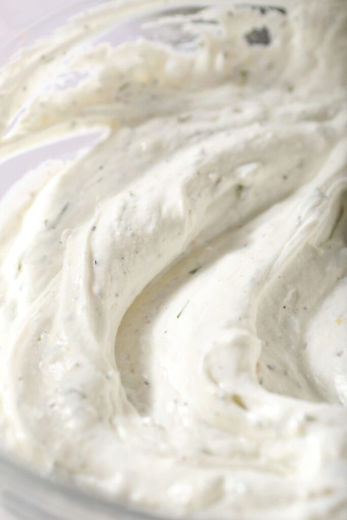 Close up of the base of tzatziki sauce in a bowl