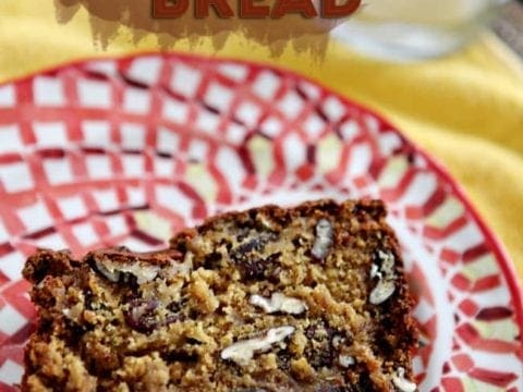 Close up of a slice of Walnut and Pecan Banana Bread on a red patterned plate