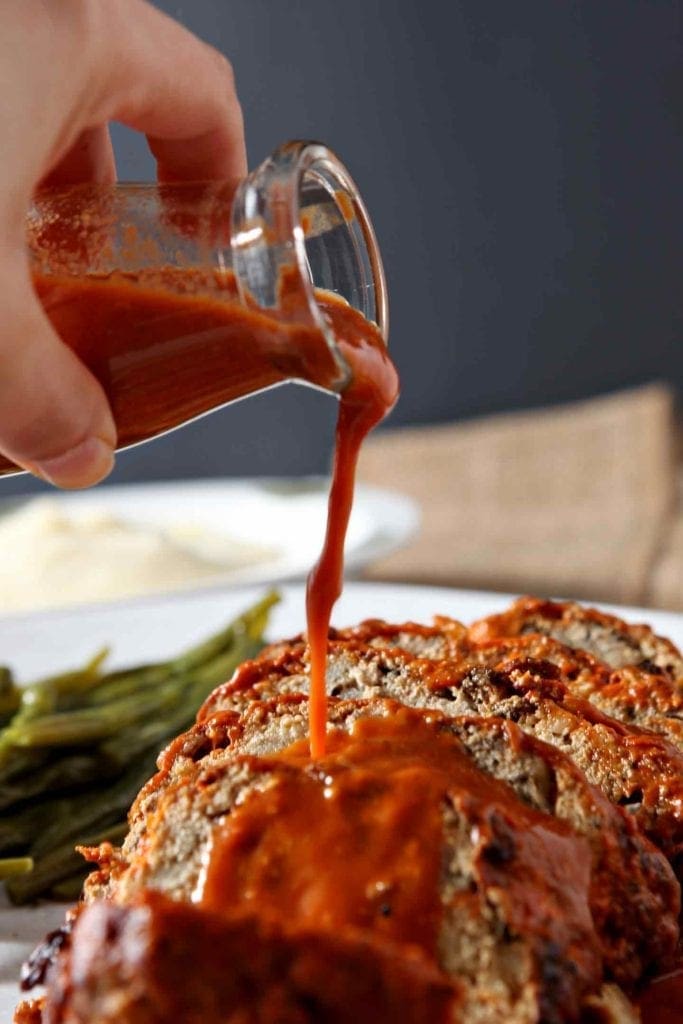 Sauce is poured on top of Slow Cooker Turkey Meatloaf