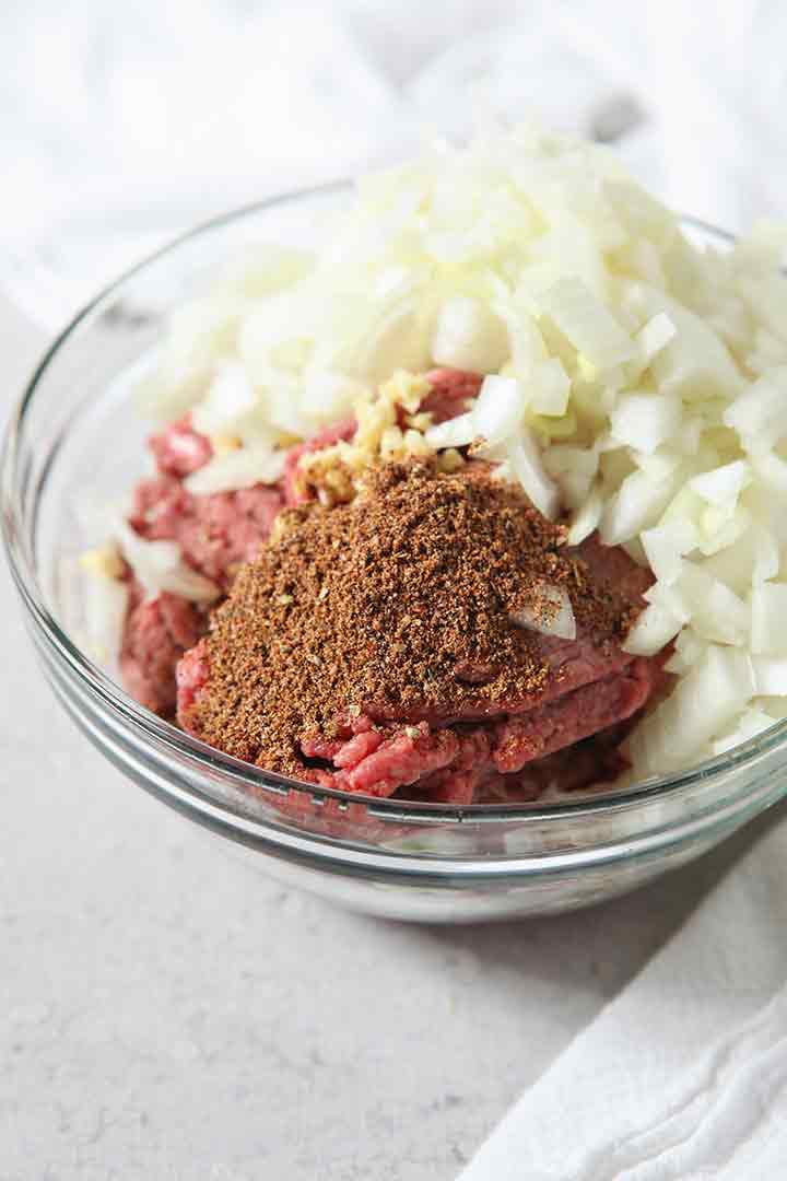 Close up of a bowl holding ingredients before cooking