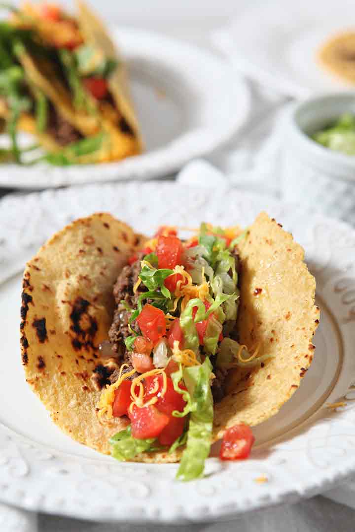 Close up of a soft shell ground Beef Taco with toppings