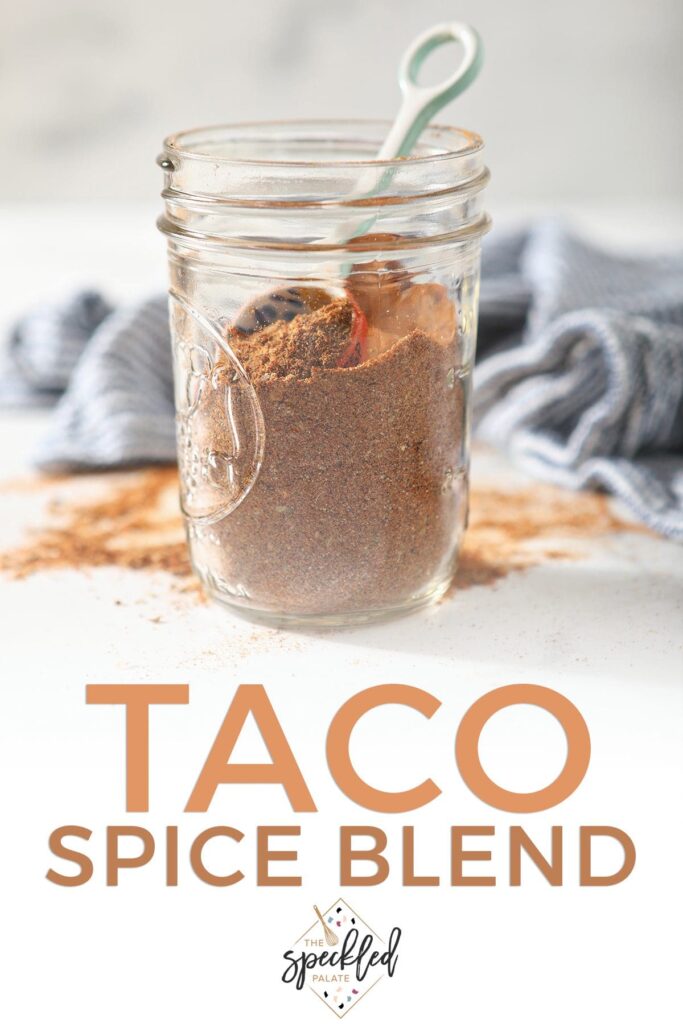 A mason jar of homemade seasoning with the text taco spice blend