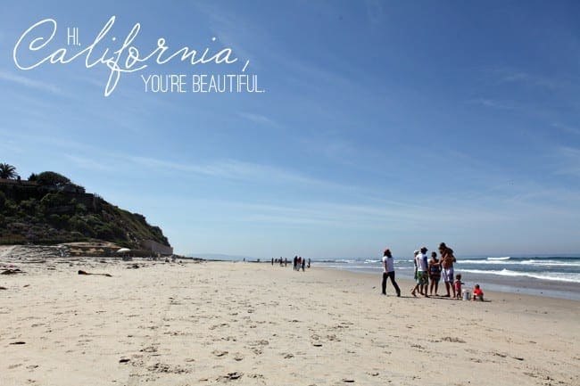 People on a beach in Southern California with the text overlay saying, "Hi, California, you're beautiful."