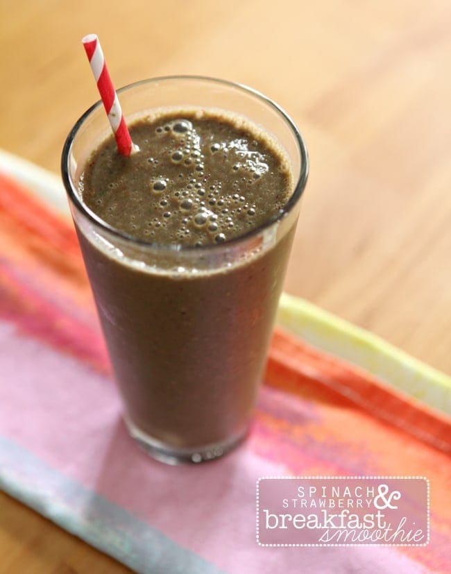 Overhead image of a Spinach Strawberry Breakfast Smoothie on a colorful kitchen towel