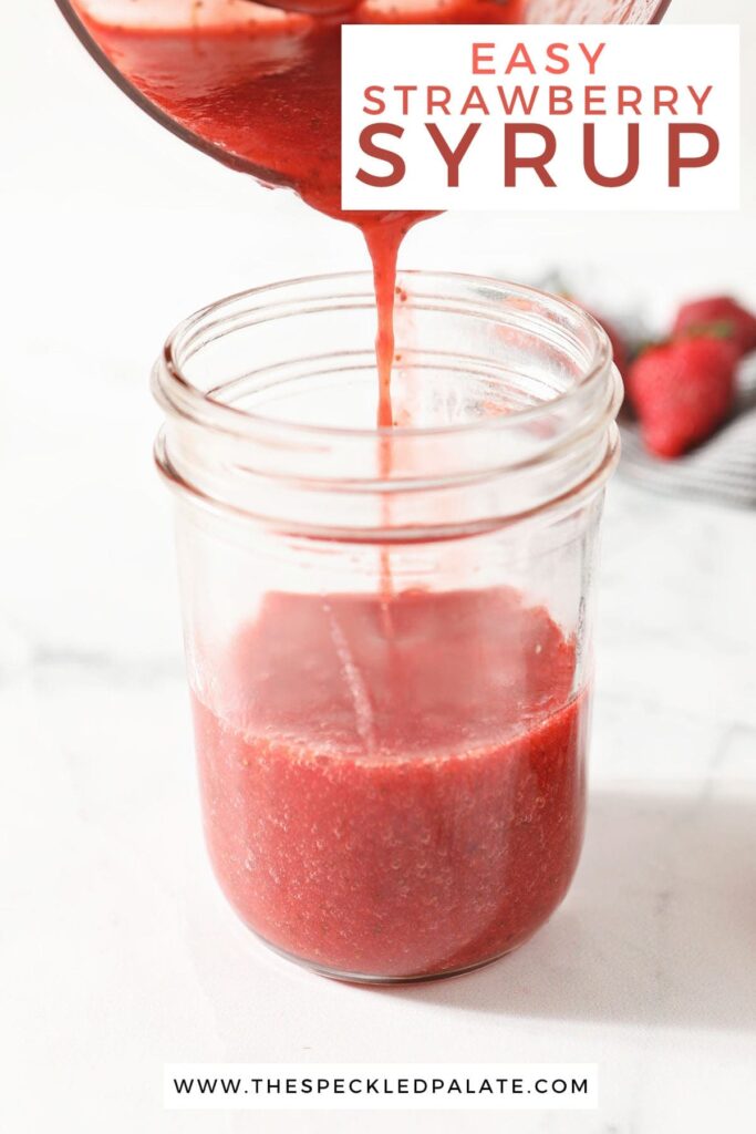 Strawberry sauce pours from a food processor into a jar with the text 'easy strawberry syrup'