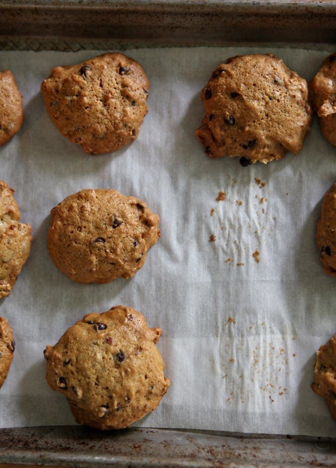 Toasted Almond Dark Chocolate Chip Cookies on parchment