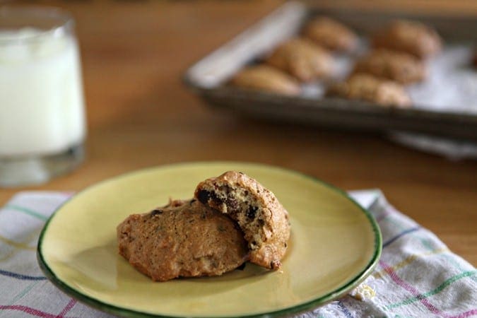 Two Toasted Almond Dark Chocolate Chip Cookies on a yellow plate