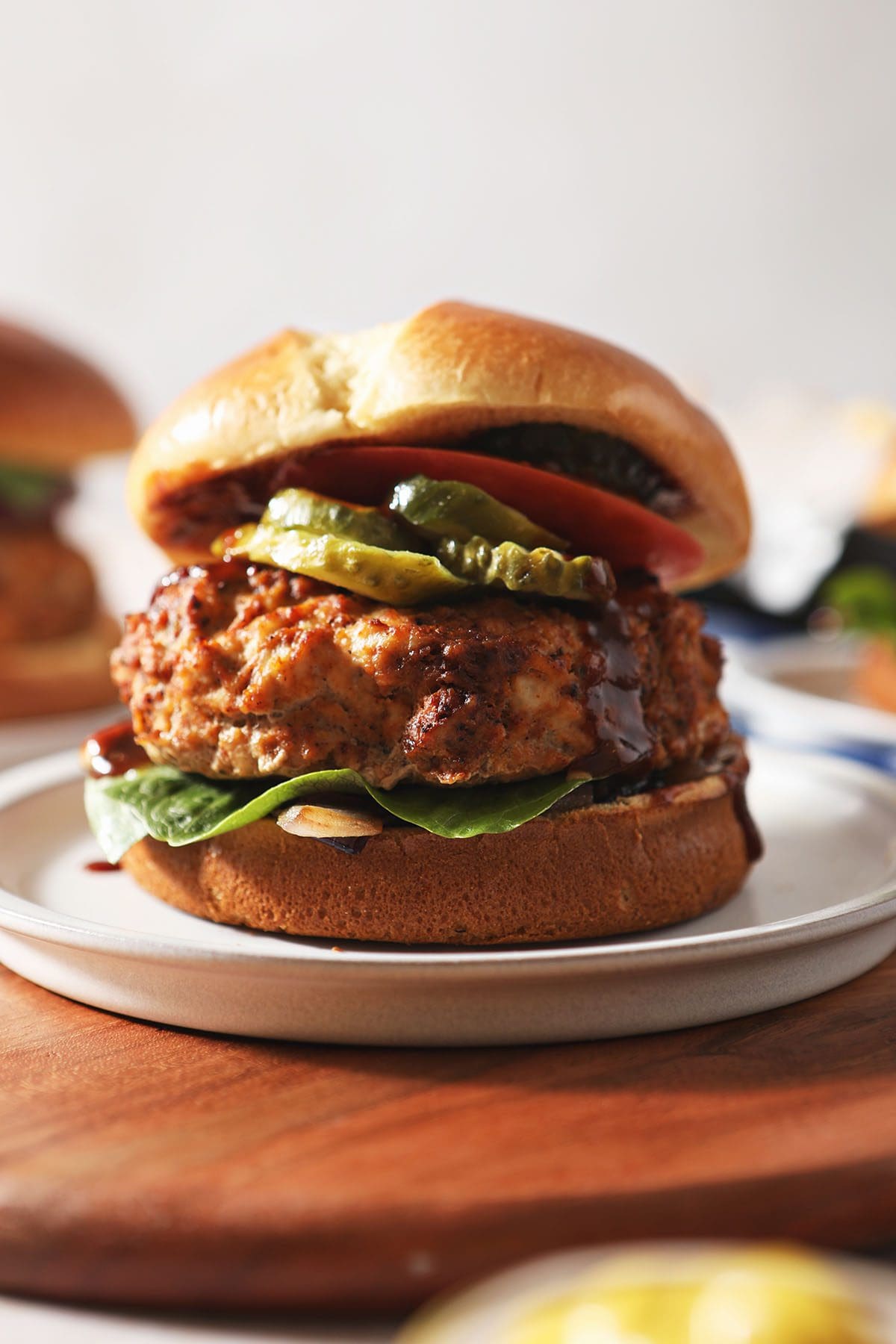 Close up of a BBQ Baked Turkey Burger on a white plate