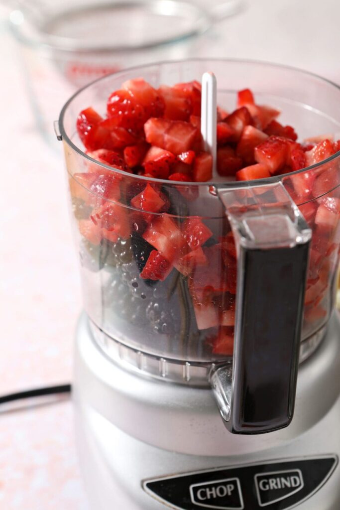 Strawberries and blackberries in a food processor