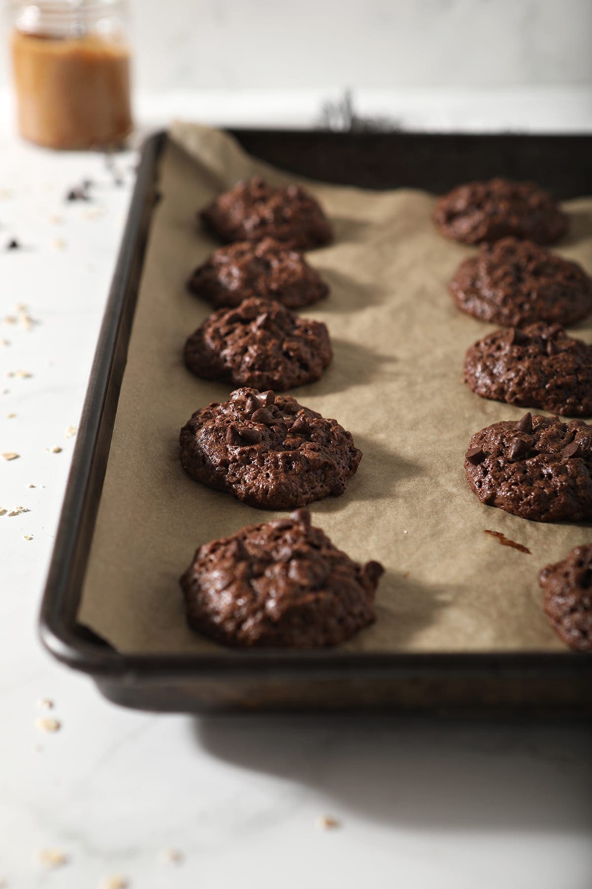 Chocolate Almond Butter Cookies with Chocolate Chips on a baking pan after baking