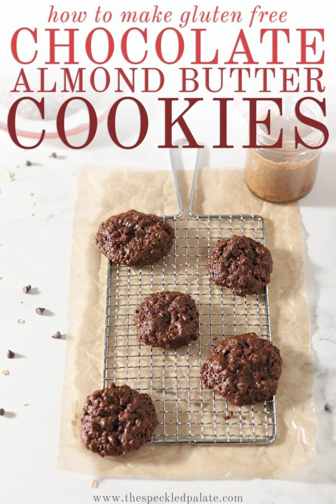 A few Gluten Free Chocolate Cookies sit on a metal grate on top of parchment paper with the text 'how to make gluten free chocolate almond butter cookies'