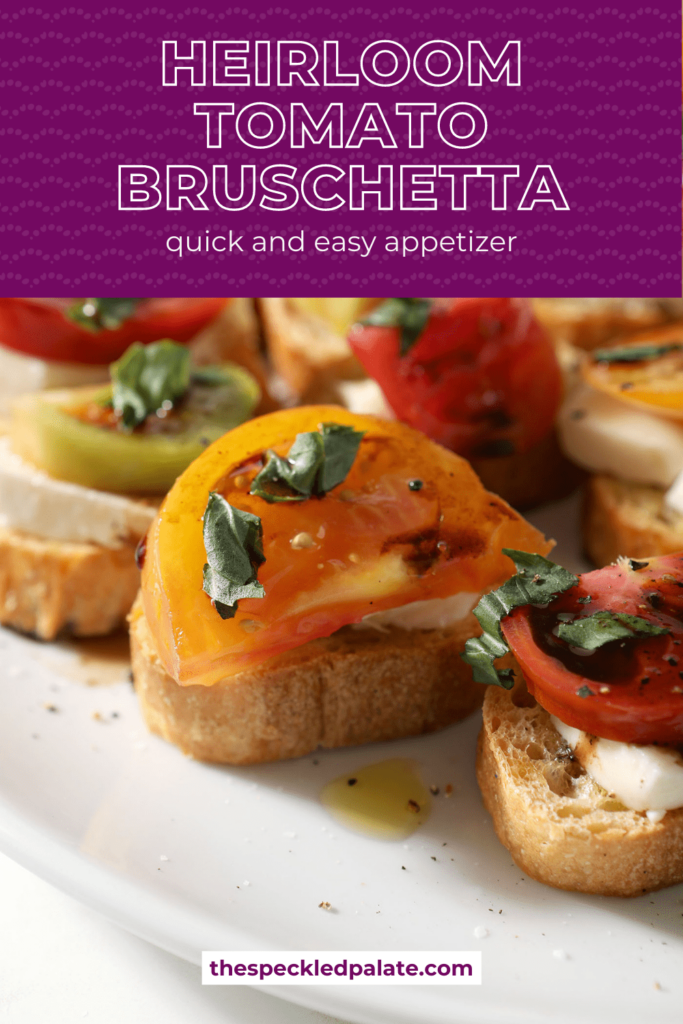 Close up of several tomato mozzarella bruschetta on a white platter with the text Heirloom Tomato Bruschetta quick and easy appetizer