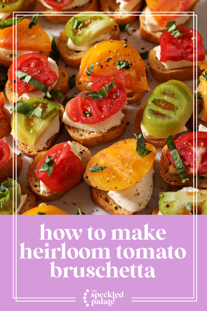 Overhead of multicolored tomatoes on toasted bread with mozzarella with the text how to make heirloom tomato bruschetta