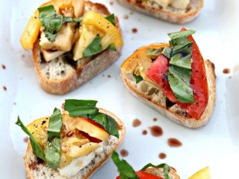 Overhead view of Heirloom Tomato Bruschetta on white serving platter 