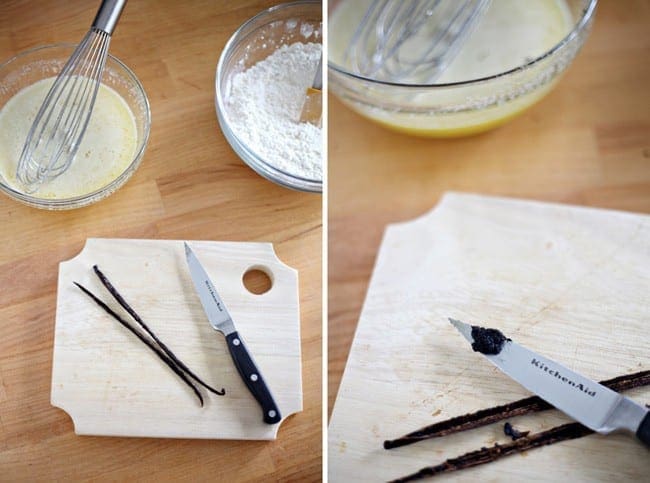 Two vanilla beans on cutting board with knife and bowls of ingredients 