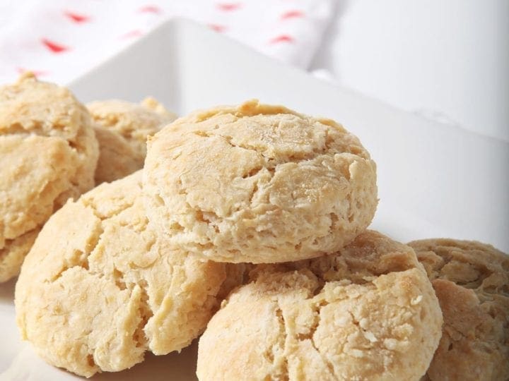 A plate of vegan biscuits on top of a red patterned towel