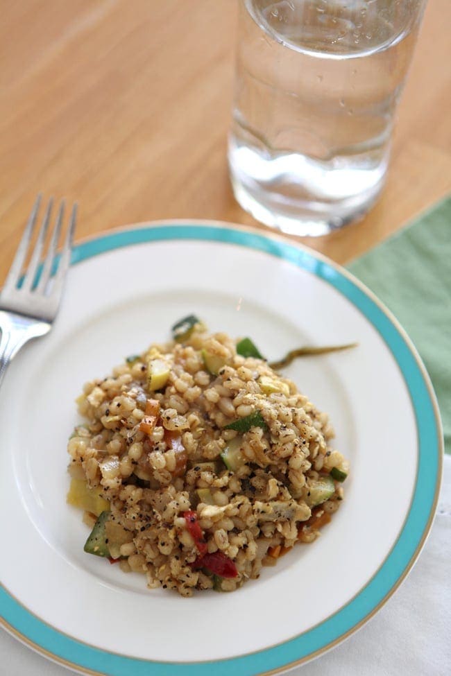 A plate holds a serving of Veggie Fried Barley