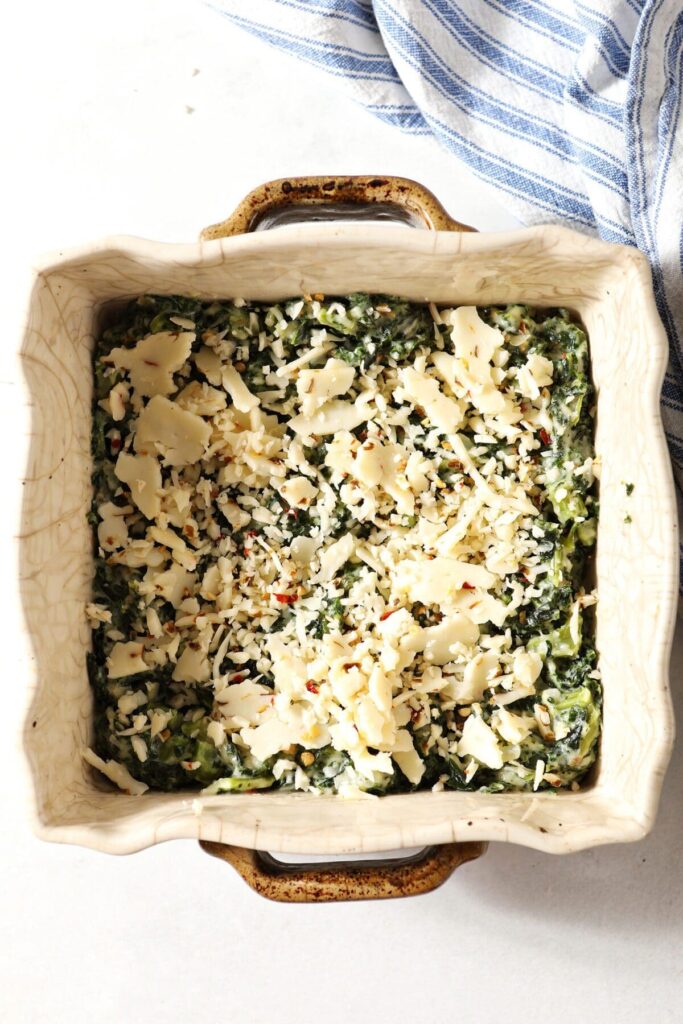 Kale Madeline in a casserole dish before going into the oven