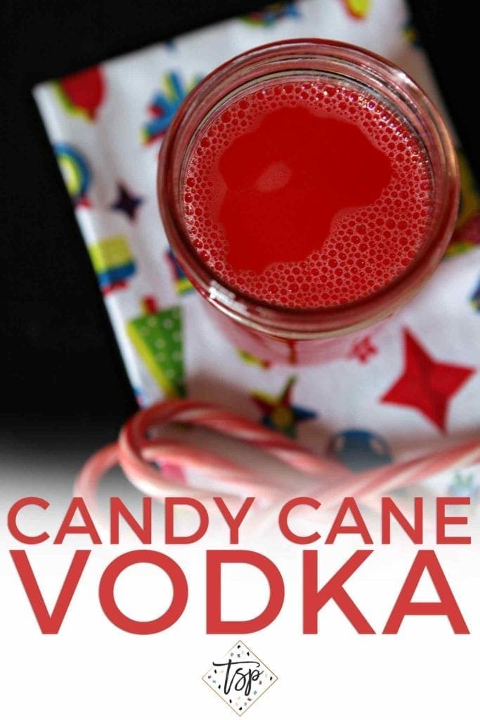 Pinterest image for Candy Cane Vodka, showing the mason jar from above after the infusion