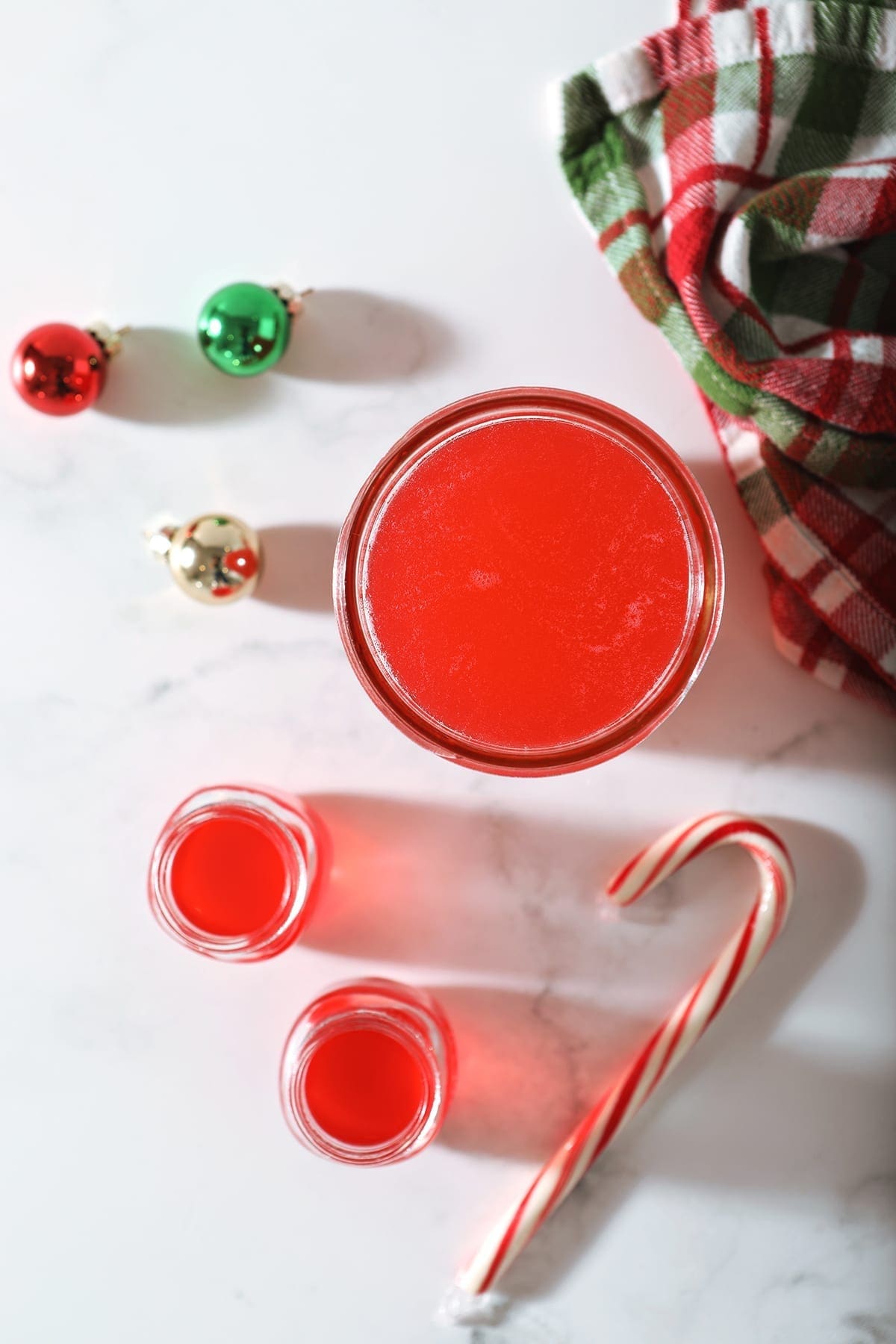 peppermint vodka in a glass jar with ornaments